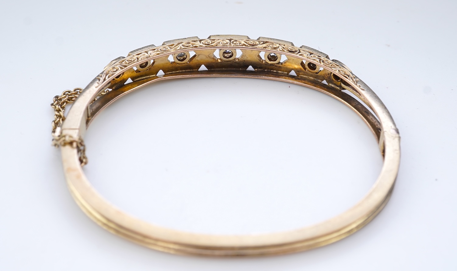 An Edwardian seed pearl and diamond bangle, early 20th century